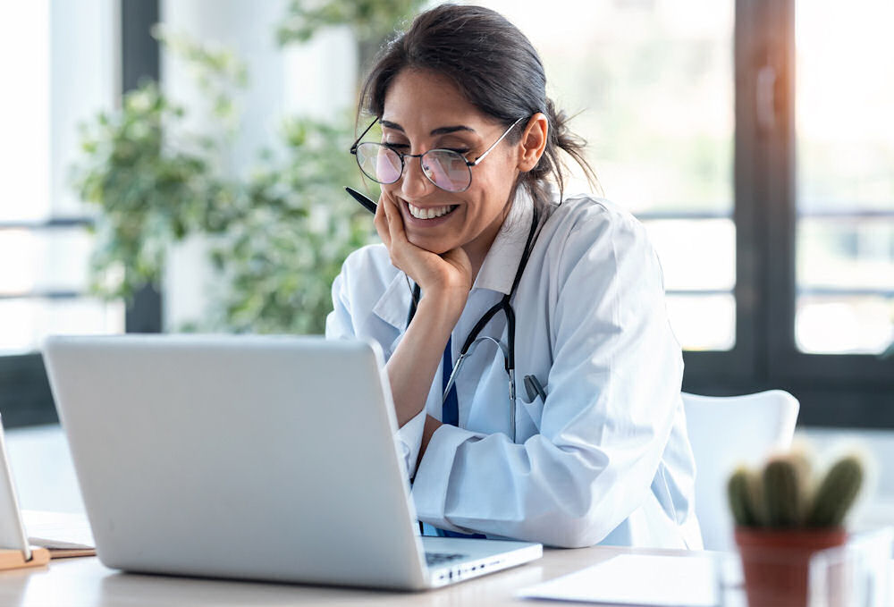 health expert talking to patient using laptop
